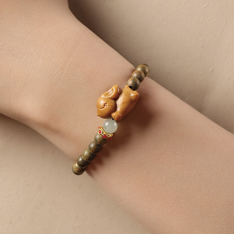 Braccialetto positivo con coniglio carino in legno di sandalo verde e oro Buddha Stones