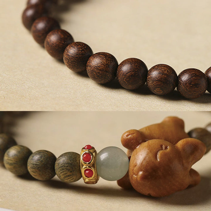 Braccialetto positivo con coniglio carino in legno di sandalo verde e oro Buddha Stones