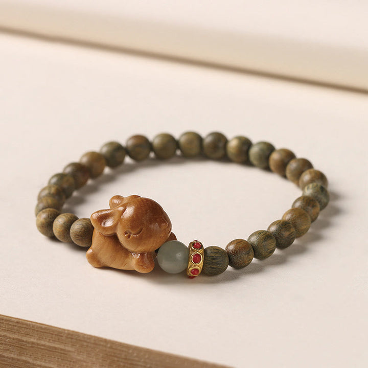 Braccialetto positivo con coniglio carino in legno di sandalo verde e oro Buddha Stones