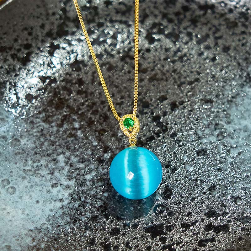 Buddha Stones Collana con ciondolo a forma di palla rotonda con occhio di gatto e simbolo di fiducia - image 3