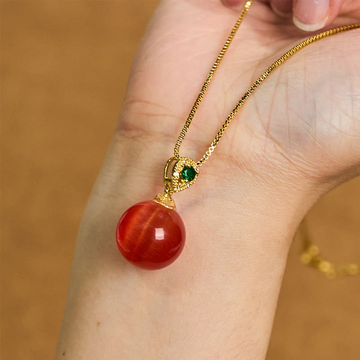 Buddha Stones Collana con ciondolo a forma di palla rotonda con occhio di gatto e simbolo di fiducia - image 10