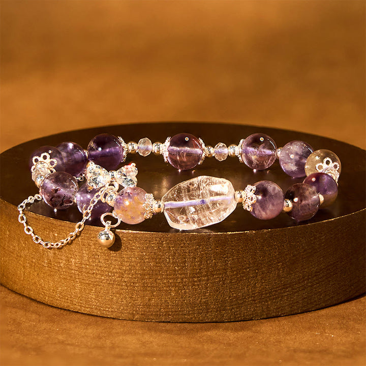 Braccialetto della saggezza con arco fantasma viola naturale Buddha Stones