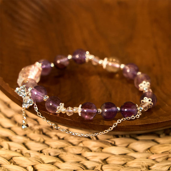 Braccialetto della saggezza con arco fantasma viola naturale Buddha Stones