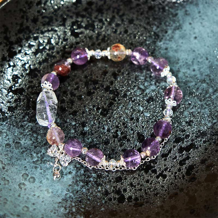 Braccialetto della saggezza con arco fantasma viola naturale Buddha Stones