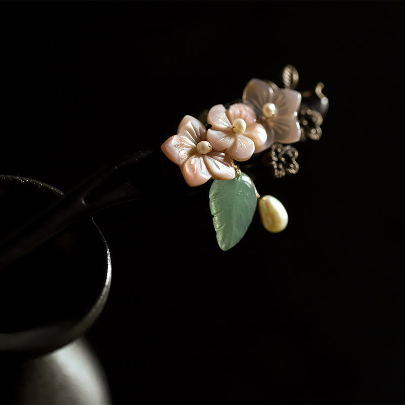 Forcina per capelli con foglie di fiori di conchiglia di ebano Buddha Stones