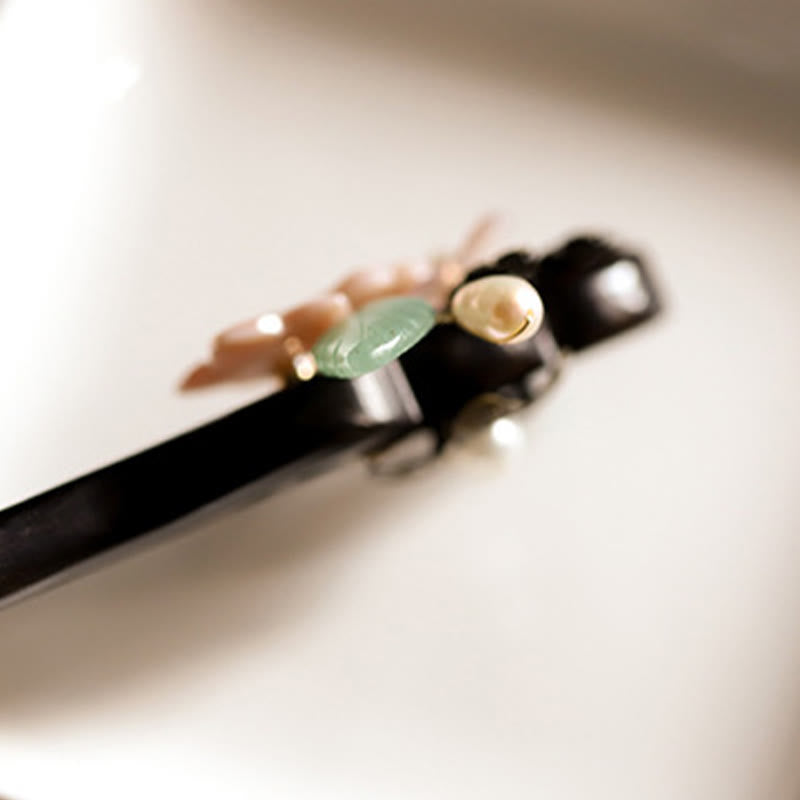 Forcina per capelli con foglie di fiori di conchiglia di ebano Buddha Stones