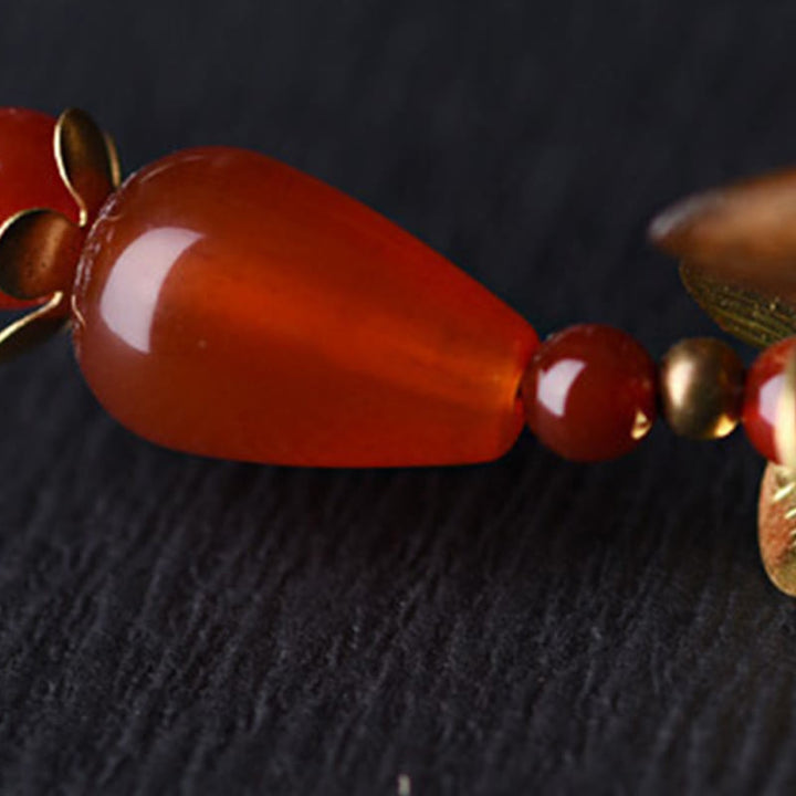 Forcina per capelli lenitiva con nappa in argento e sandalo verde Buddha Stones