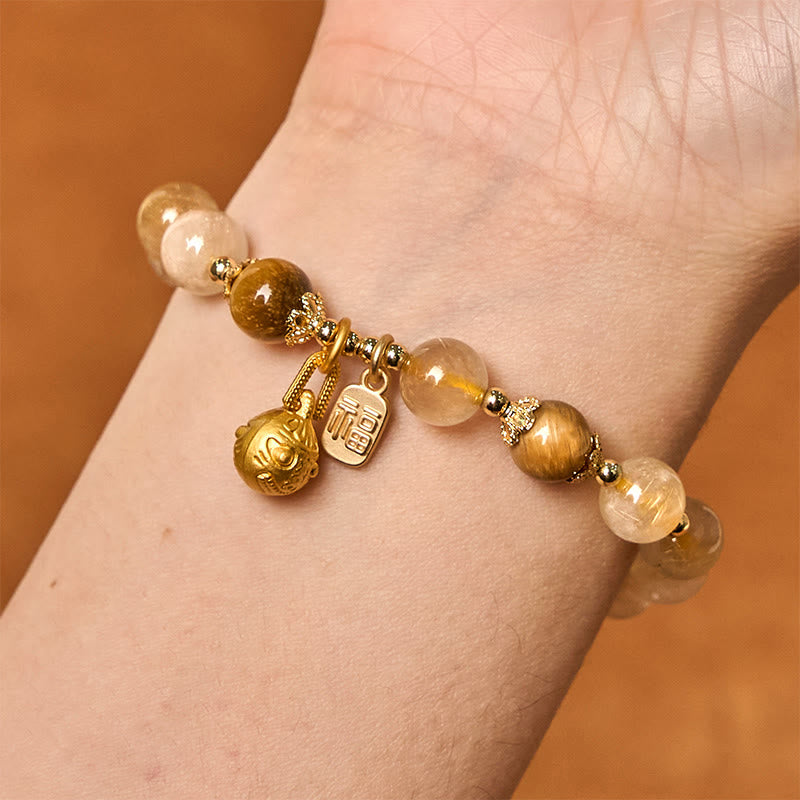 Braccialetto di auspicio Buddha Stones in quarzo rutilato naturale Fu Character Metal che ingoia la bestia