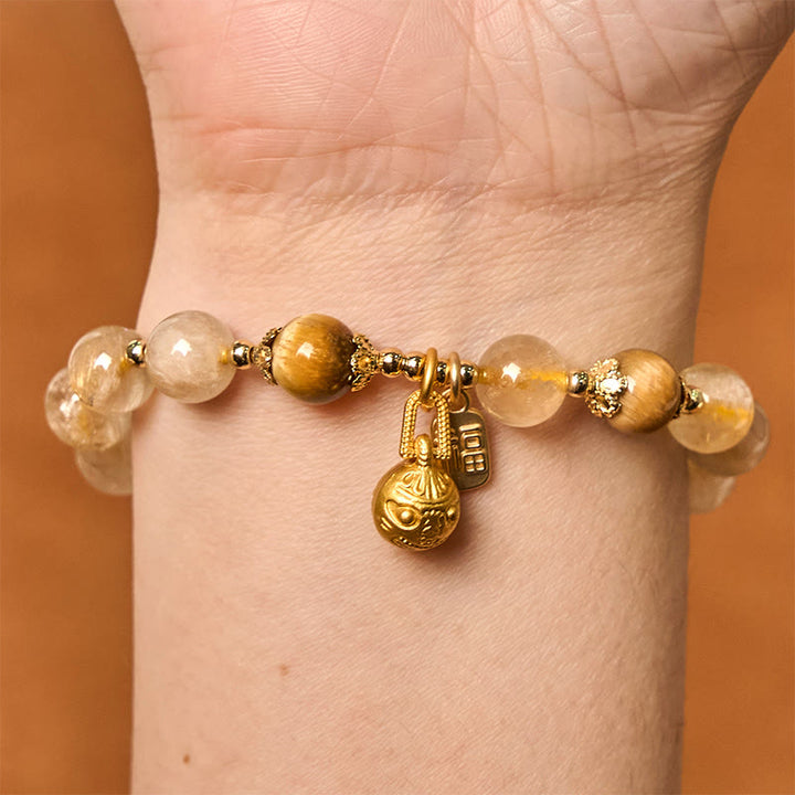 Braccialetto di auspicio Buddha Stones in quarzo rutilato naturale Fu Character Metal che ingoia la bestia