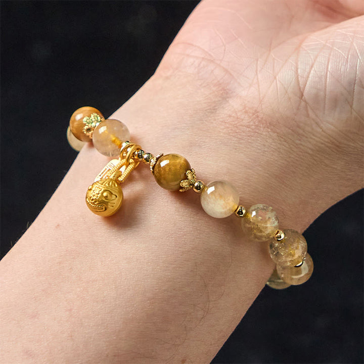 Braccialetto di auspicio Buddha Stones in quarzo rutilato naturale Fu Character Metal che ingoia la bestia