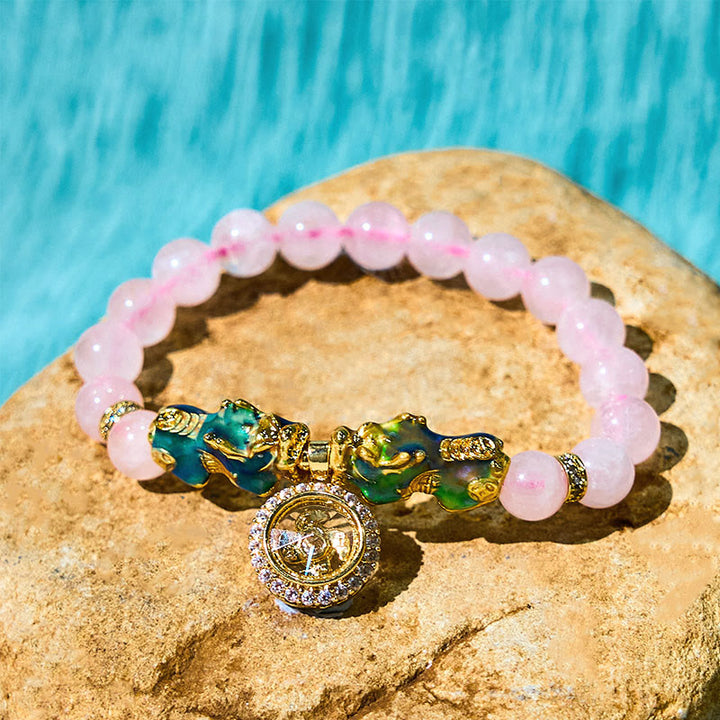 Braccialetto con ciondolo a forma di ciclone PiXiu Buddha Stones e cristallo rosa che cambia colore