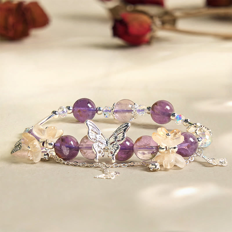 Braccialetto della saggezza dei fiori di farfalla fantasma viola naturale di Buddha Stones