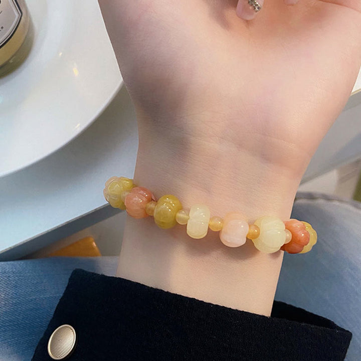 Braccialetto di fortuna e ricchezza con perle di zucca in giada di seta dorata e Buddha Stones