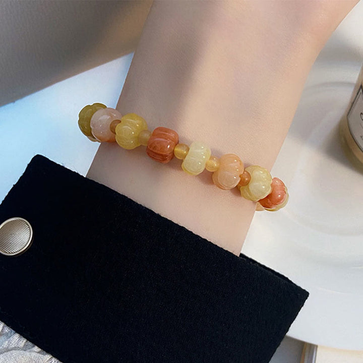 Braccialetto di fortuna e ricchezza con perle di zucca in giada di seta dorata e Buddha Stones