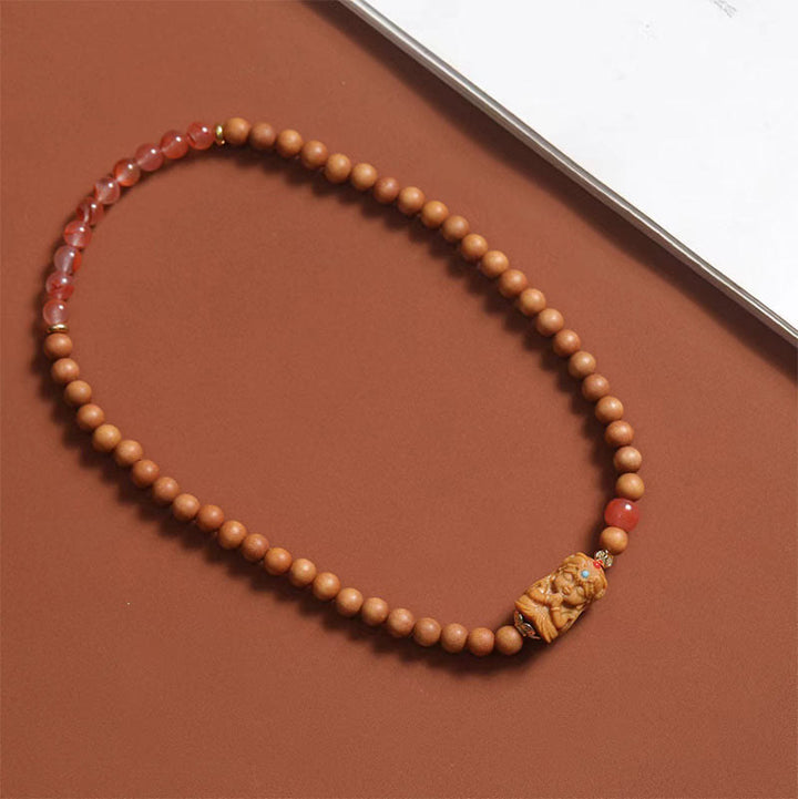 Bracciale della fortuna in agata rossa del sud, sandalo e Buddha Stones tibetane Zakiram, dea della ricchezza