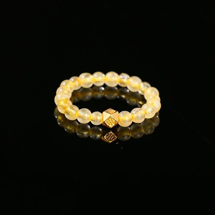 Anello elastico con perle di quarzo rutilato dorato da 3 mm Buddha Stones