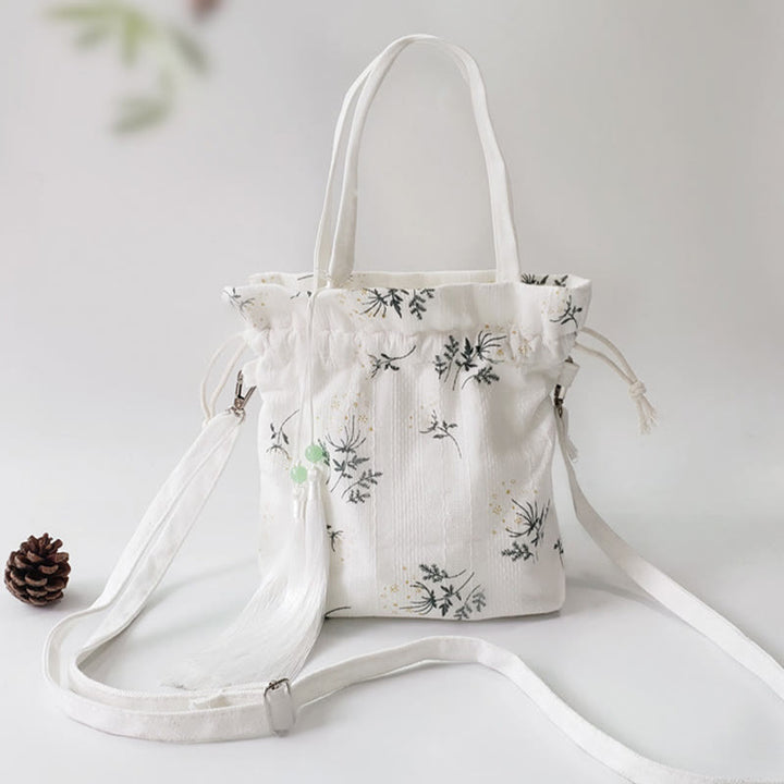Borsa a tracolla in tela con fiori bianchi e foglie verdi, motivo Buddha Stones