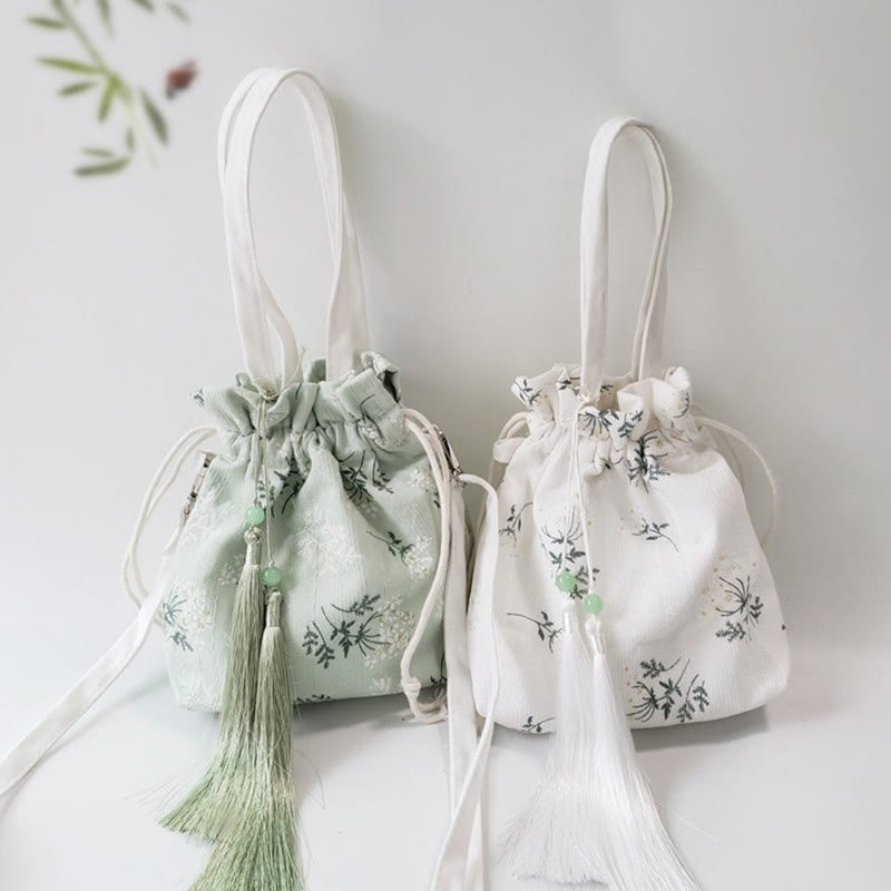 Borsa a tracolla in tela con fiori bianchi e foglie verdi, motivo Buddha Stones