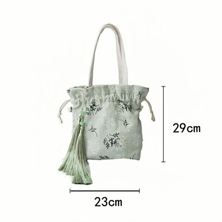 Borsa a tracolla in tela con fiori bianchi e foglie verdi, motivo Buddha Stones