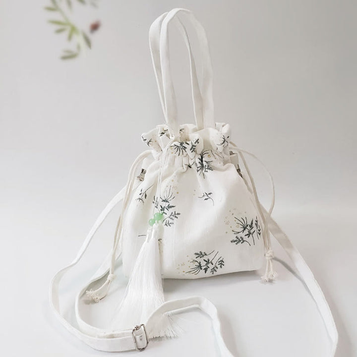 Borsa a tracolla in tela con fiori bianchi e foglie verdi, motivo Buddha Stones