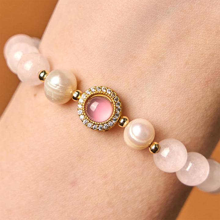 Braccialetto Buddha Stones con perle di cristallo rosa e calore