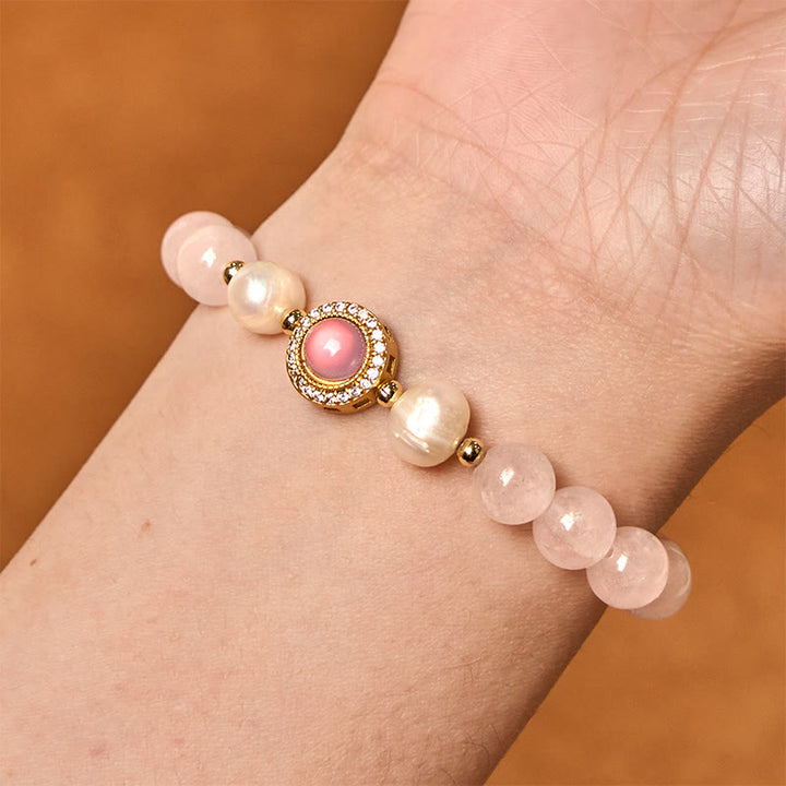 Braccialetto Buddha Stones con perle di cristallo rosa e calore