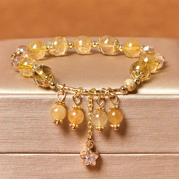 Braccialetto di auspicio con stelle a quadrifoglio e quarzo rutilato giallo colorato naturale di Buddha Stones
