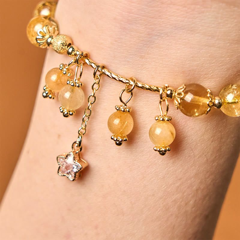 Braccialetto di auspicio con stelle a quadrifoglio e quarzo rutilato giallo colorato naturale di Buddha Stones