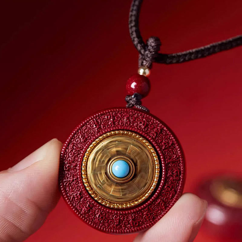 Collana con ciondolo a corda con motivo Yin Yang e scrittura girevole in cinabro naturale Om Mani Padme Hum, Buddha Stones.