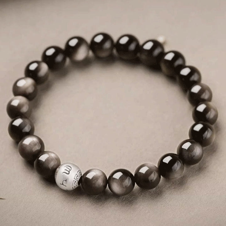 Bracciale di protezione Om Mani Padme Hum in ossidiana naturale lucida e argento Buddha Stones