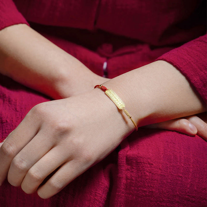 Braccialetto di corda dorata rossa con amuleto di protezione in rame placcato oro 14K Buddha Stones