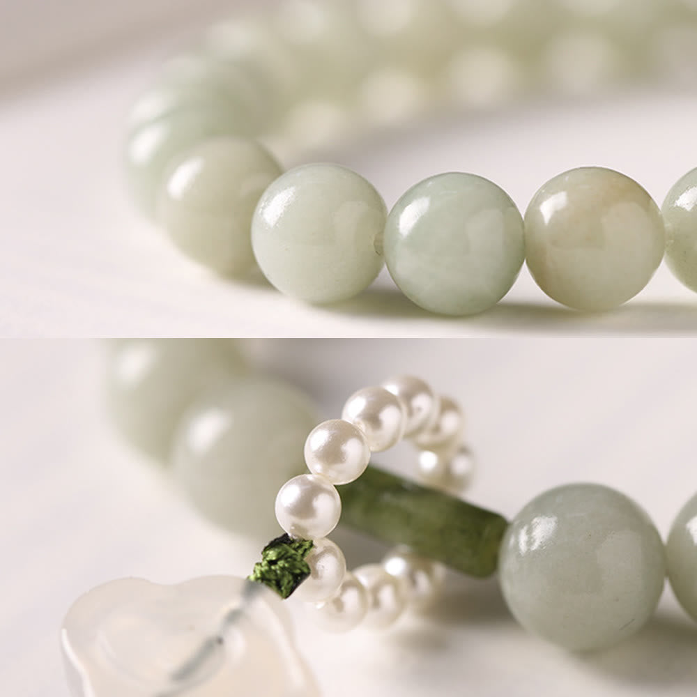 Mala da polso Buddha Stones, perle di giada verde e nappe di prosperità.