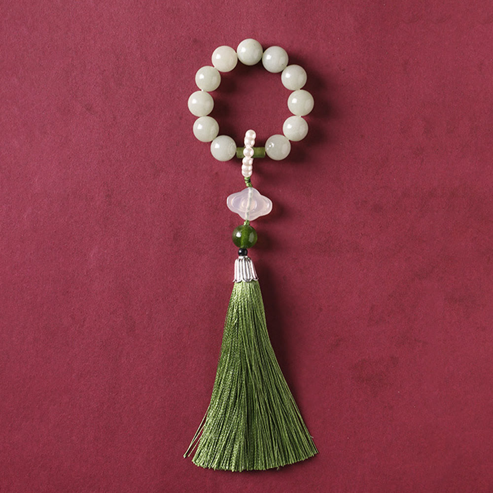 Mala da polso Buddha Stones, perle di giada verde e nappe di prosperità.