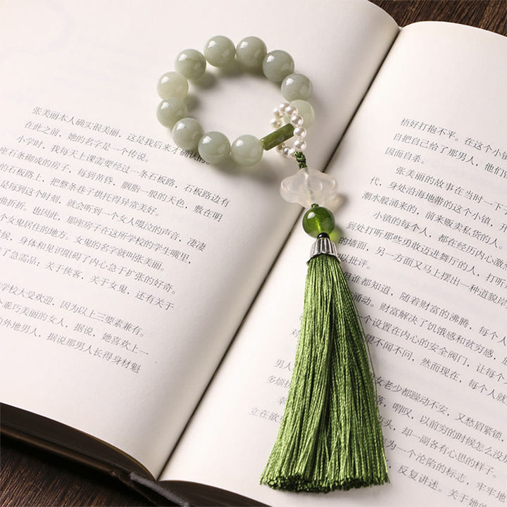 Mala da polso Buddha Stones, perle di giada verde e nappe di prosperità.