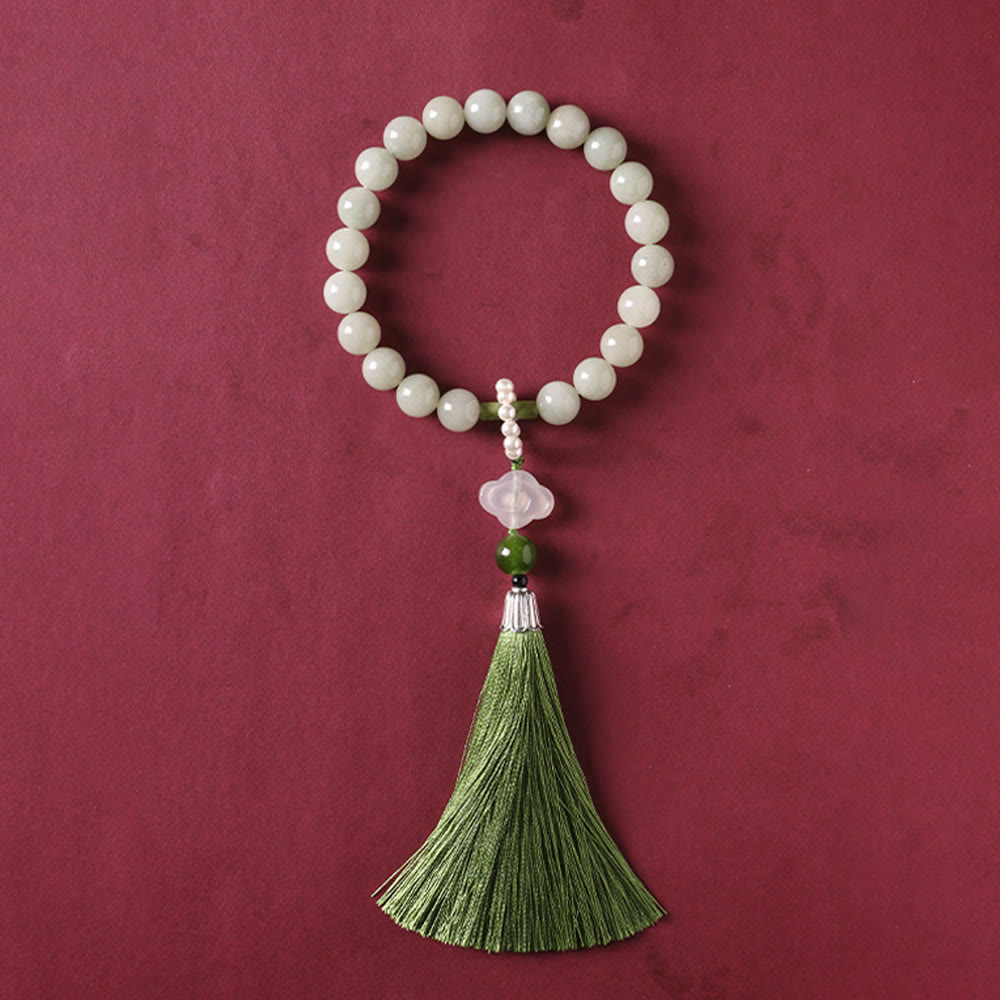 Mala da polso Buddha Stones, perle di giada verde e nappe di prosperità.