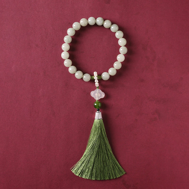 Mala da polso Buddha Stones, perle di giada verde e nappe di prosperità.