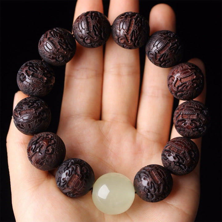 Braccialetto PiXiu Warmth con incisione in palissandro tibetano Buddha Stones