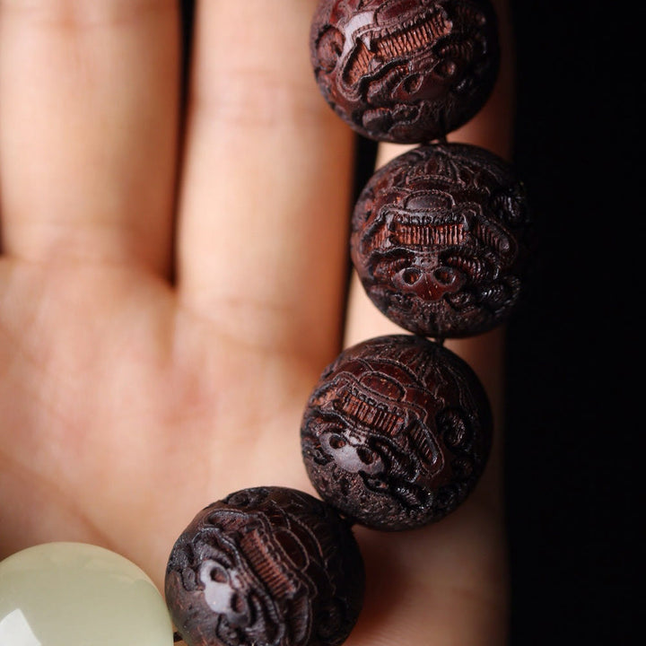 Braccialetto PiXiu Warmth con incisione in palissandro tibetano Buddha Stones