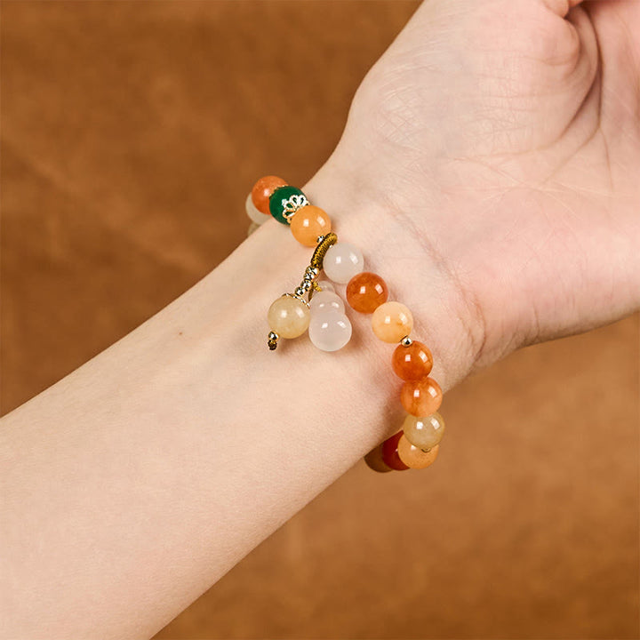 Braccialetto di fortuna e ricchezza di zucca con perle di giada di seta dorata e Buddha Stones
