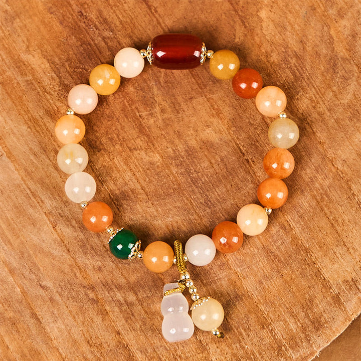 Braccialetto di fortuna e ricchezza di zucca con perle di giada di seta dorata e Buddha Stones