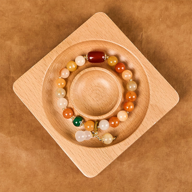 Braccialetto di fortuna e ricchezza di zucca con perle di giada di seta dorata e Buddha Stones