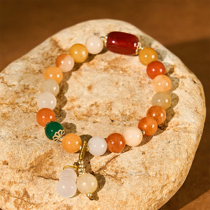 Braccialetto di fortuna e ricchezza di zucca con perle di giada di seta dorata e Buddha Stones