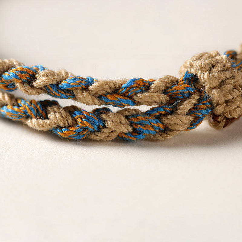 Bracciale intrecciato con Buddha Stones per la protezione della ricchezza