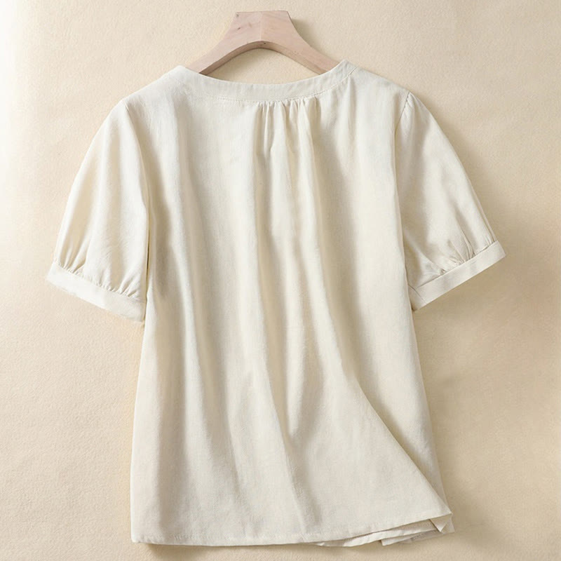Camicia da donna casual a maniche corte con scollo rotondo e bottoni, con stampa Buddha Stones. - image 1