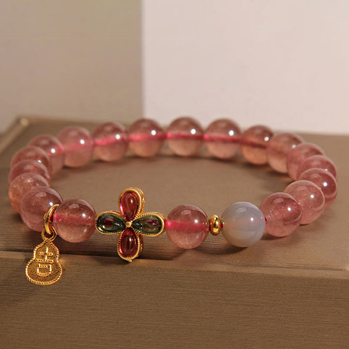 Braccialetto curativo Buddha Stones, Quarzo Fragola, Quadrifoglio, Zucca Portafortuna