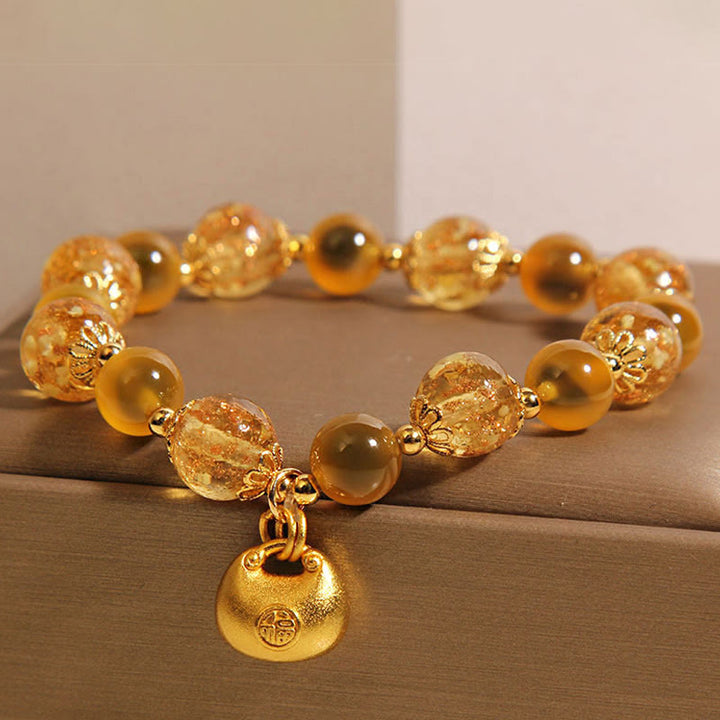 Braccialetto curativo con borsa della benedizione del carattere Fu in agata gialla caramellata Buddha Stones
