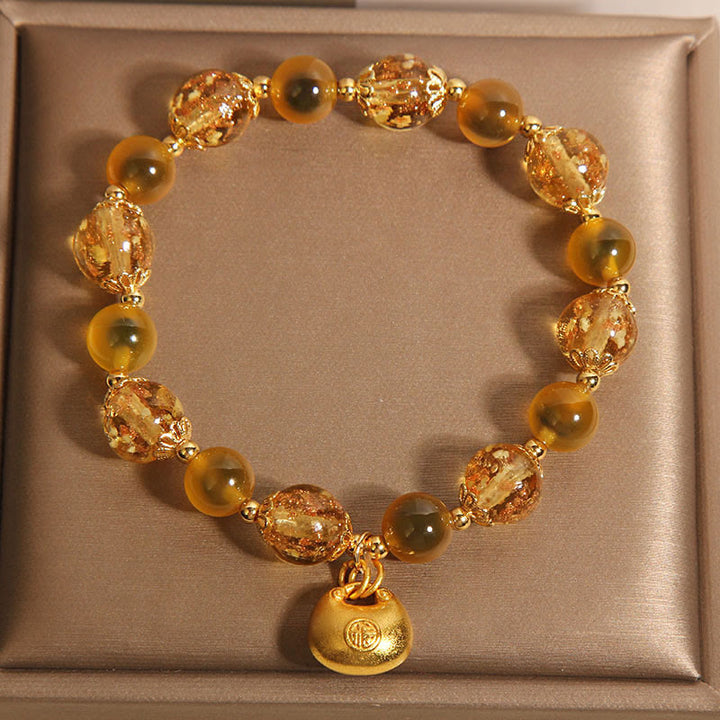 Braccialetto curativo con borsa della benedizione del carattere Fu in agata gialla caramellata Buddha Stones