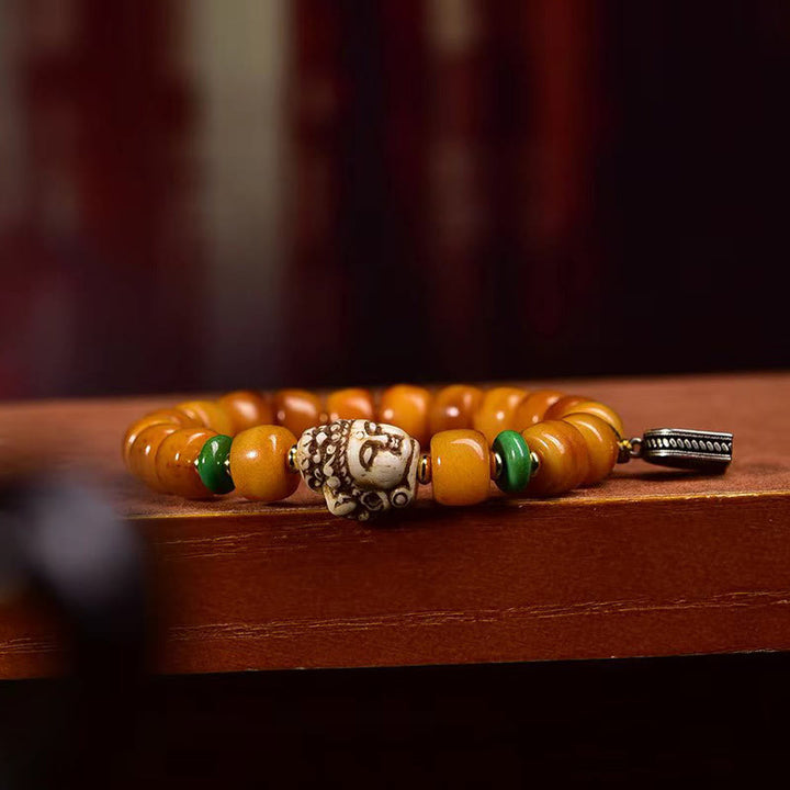 Braccialetto di protezione dalla fortuna con testa di Buddha, perline di osso di cammello tibetano naturale , Buddha Stones