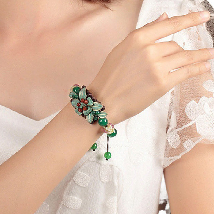Bracciale con supporto a nodo intrecciato in perline di vetro agata verde Buddha Stones