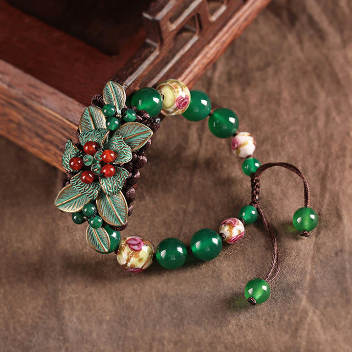 Bracciale con supporto a nodo intrecciato in perline di vetro agata verde Buddha Stones